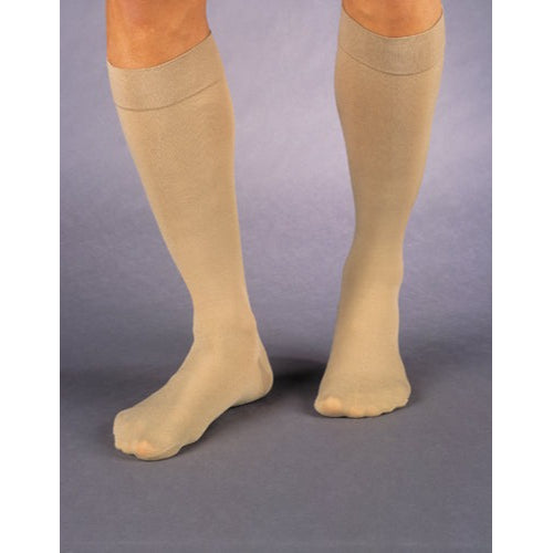 Pair of beige Jobst Relief 30-40 mmHg knee-high compression socks, large-full calf size