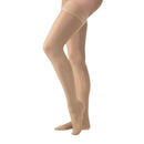 Jobst Ultrasheer Thigh-High Compression Stockings 15-20 mmHg in Sun Tan offer effective leg health support and stylish relief for improved circulation and comfort throughout the day, Moovkart.
