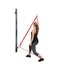 Wall-mounted TheraBand CLX system including soft grip handles, extremity straps, and head strap. Moovkart