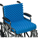 Installed on wheelchair showing even weight distribution and ventilation, Moovkart