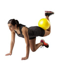 Thera-Band Mini Ball 9-inch Yellow in use for balance and abdominal workouts, Moovkart